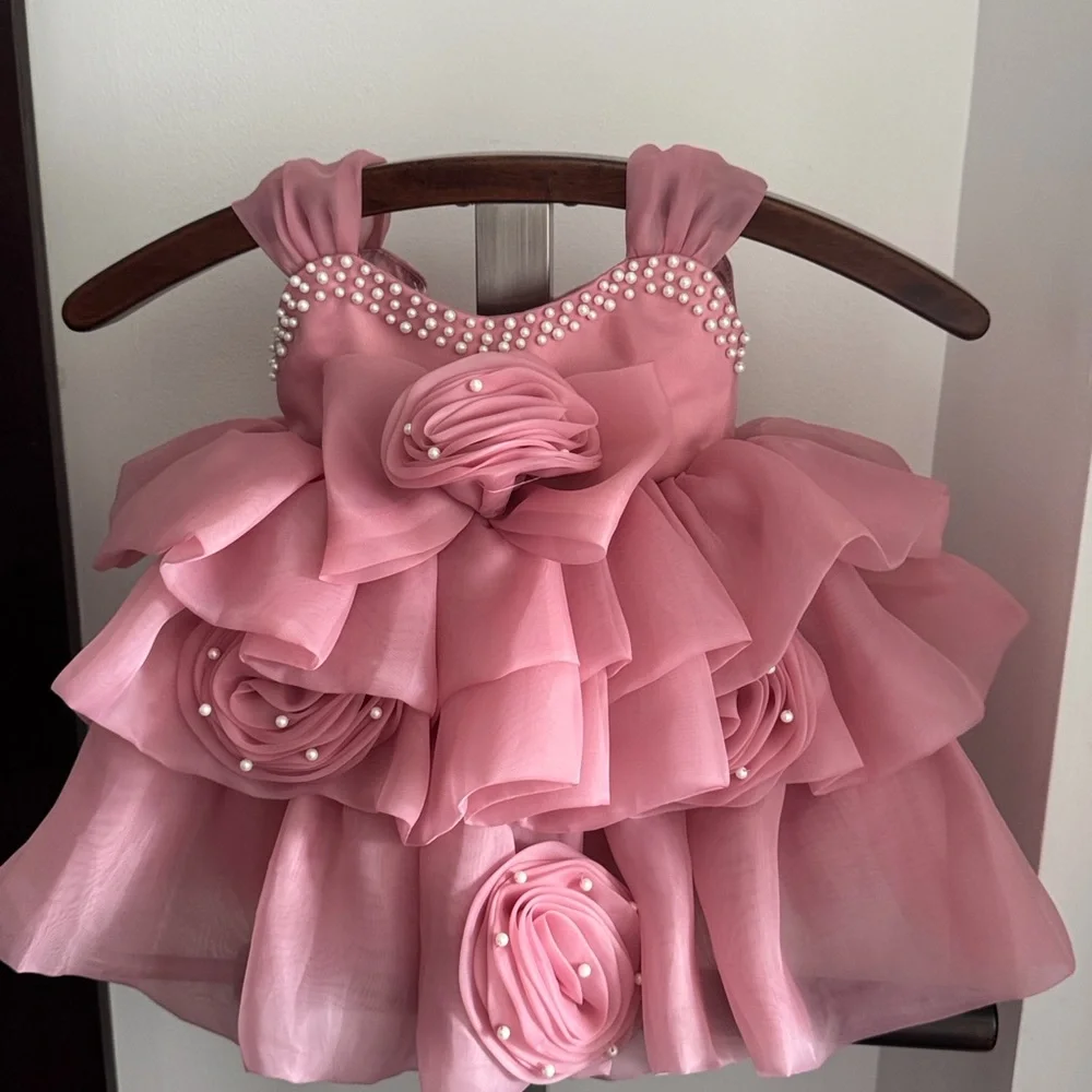 Baby girl Pink Ruffled Dress with Pearl Accents. Perfect for birthday